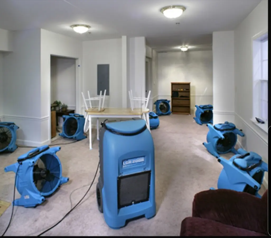 Air movers and dehumidifier setup for Water Damage Restoration in Bensville